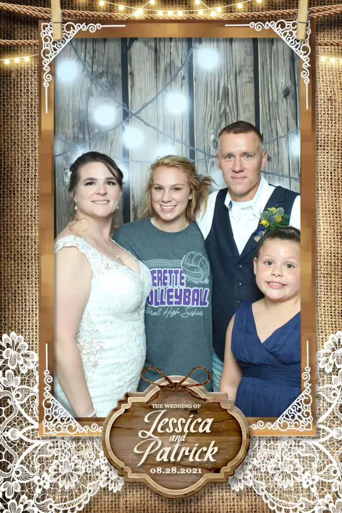 Wedding photo booth print of a bride with family, personalized with the couple’s names